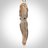 Hand carved octopus pendant. This piece has been carved in minute detail from deer antler. The artist is Fumio Noguchi, a renowned New Zealand bone carver who carves pieces for NZ Pacific. These unique bone pendants are for sale online at nzpacific.com One only collectors item for lovers of the ocean and octopus.