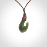 Small New Zealand jade hei-matau, hook, pendant.
