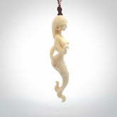This pendant is a gorgeous and intricately carved mermaid and merman pendant. Carved by renowned bone carver Yuri Terenyi for us, this is a little masterpiece. The craftsmanship displayed in this piece is extraordinary - a collectors item, or a piece to wear and love.