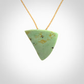 This is a lovely New Zealand Jade, pounamu niho drop pendant. It is bound with an adjustable beige coloured cord which is length adjustable.