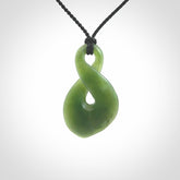 This piece is a fine, delicate drop shaped, single twist pendant. It was carved for us by Ric Moor from a lovely deep green piece of New Zealand jade. It is suspended on an black four plaited braided cord that is length adjustable.