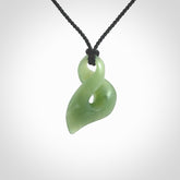 Hand carved small sized, New Zealand Inanga jade twist pendant.