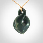 This piece is a drop shaped, single twist pendant. It was carved for us by Ric Moor from a lovely deep green piece of New Zealand jade. It is suspended on an beige four plaited braided cord that is length adjustable.
