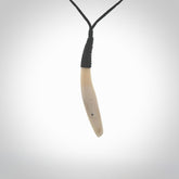 Hand carved sperm whale pendant, carved for us by Fumio Noguchi. This piece is carved from bone and is a fantastic depiction of these giants of the deep. This particular piece is a sperm whale design and is lovingly carved. Free shipping worldwide.
