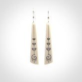 Hand carved large bone earrings with dreamcatcher engraving.