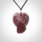 This is a hand carved love heart pendant made from a gorgeous and striking piece of Brecciated jasper stone. This is a superbly carved and very unique piece. For sale online from NZ Pacific.