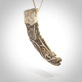 Hand carved dragon Pendant. Made from warthog tusk in New Zealand. Unique dragon necklace hand made from warthog tusk by master bone carver Fumio Noguchi. Spectacular collectable work of art, made to wear. One only pendant, delivered to you at no extra cost with express courier.