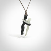 This small sized couples embrace pendant is made from Australian Black Jade and Jadeite Stone. We've hand carved this piece for all the lovers out there. Free postage worldwide. Black Jade and Jadeite Stone couple hugging jewellery. Provided with an adjustable mushroom coloured cord and packaged in a woven kete pouch.