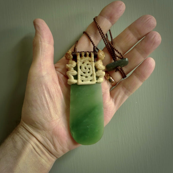 Traditional Polynesian art carved in whale bone with New Zealand Kahurangi Pounamu (Jade). The materials are a blend of whale bone and kahurangi Jade. It is provided with a hand-plaited brown cord that is a fixed length. Free shipping worldwide. One only collectable art to wear.