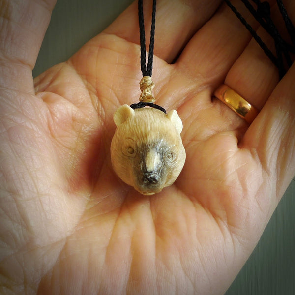 Hand carved deer antler polar bear pendant. Hand carved by NZ Pacific. Free postage worldwide. Hand made polar bear head necklace from deer antler. Animal themed necklace for men and women.