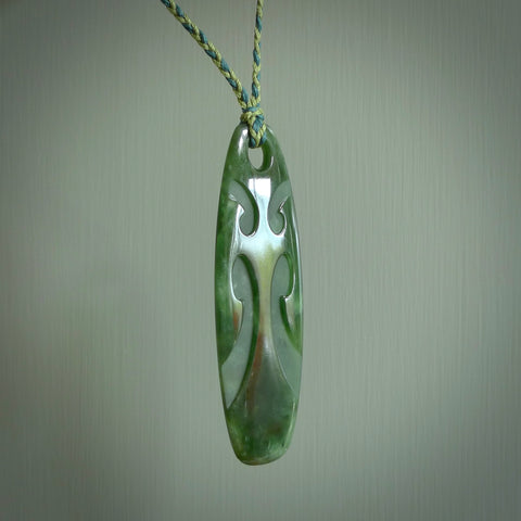 Hand made large New Zealand jade purerehua with koru pendant. Hand carved in New Zealand by Kerry Thompson. Hand made jewellery. Unique large Jade pendant with adjustable cord. Free shipping worldwide.