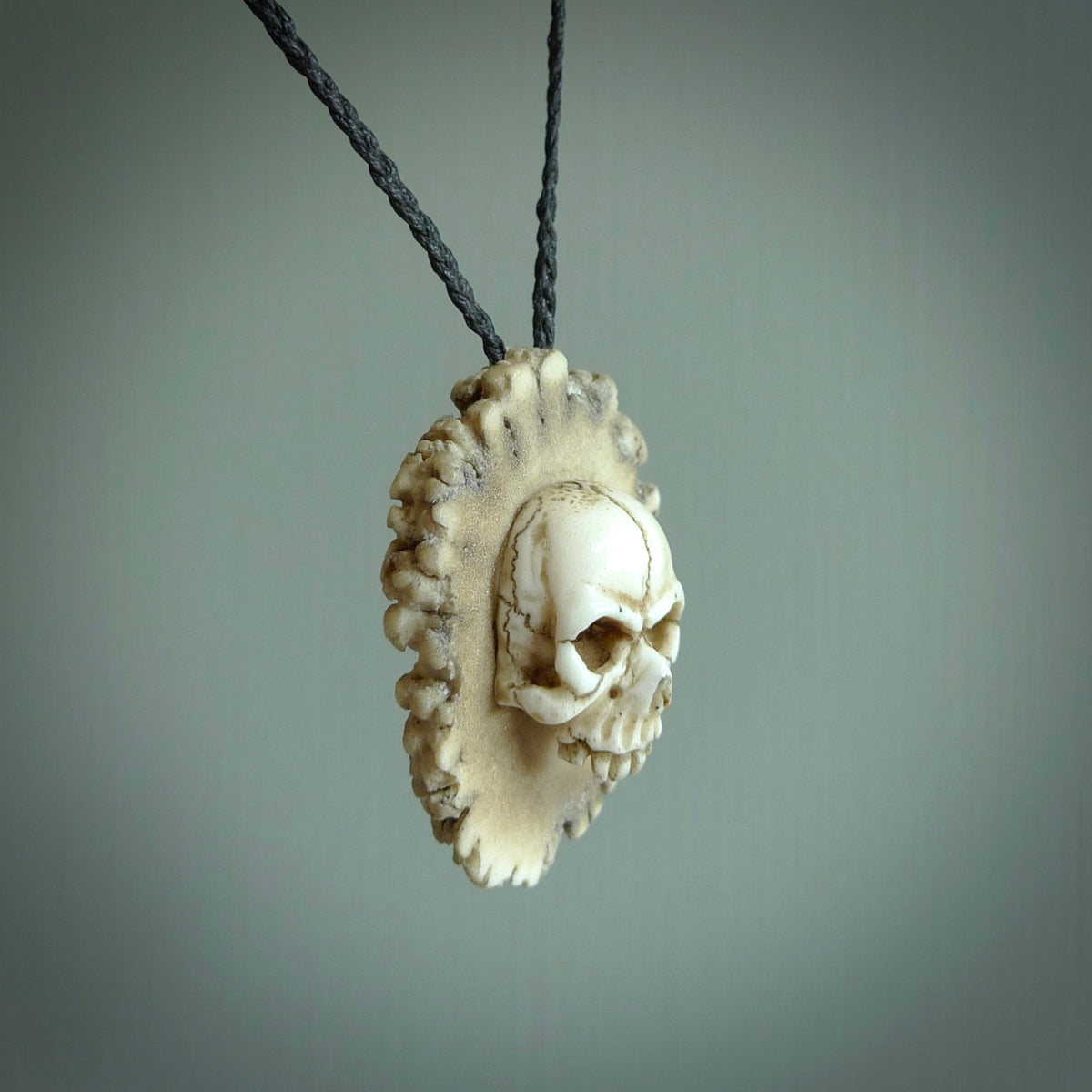 Carved store skull necklace