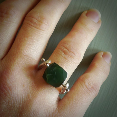 This is a handcrafted New Zealand Pounamu, Jade and sterling silver ring. This is a solid little work of art. We ship this worldwide for free and are happy to answer any questions that you may have about these or other products on our website. Hand made by Ana Krakosky.