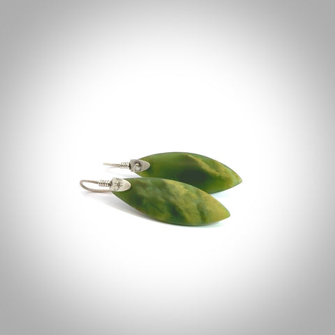 These are stunning medium sized drop flower jade earrings carved in New Zealand by Josey Coyle. It is carved from a beautiful green piece of New Zealand Flower Jade and with Sterling Silver hooks and findings.