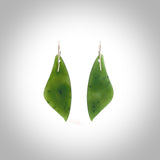 These are stunning large butterfly wing shaped drop jade earrings carved in New Zealand by Josey Coyle. It is carved from a deep, semi-translucent green piece of New Zealand Jade and with Sterling Silver hooks and findings.