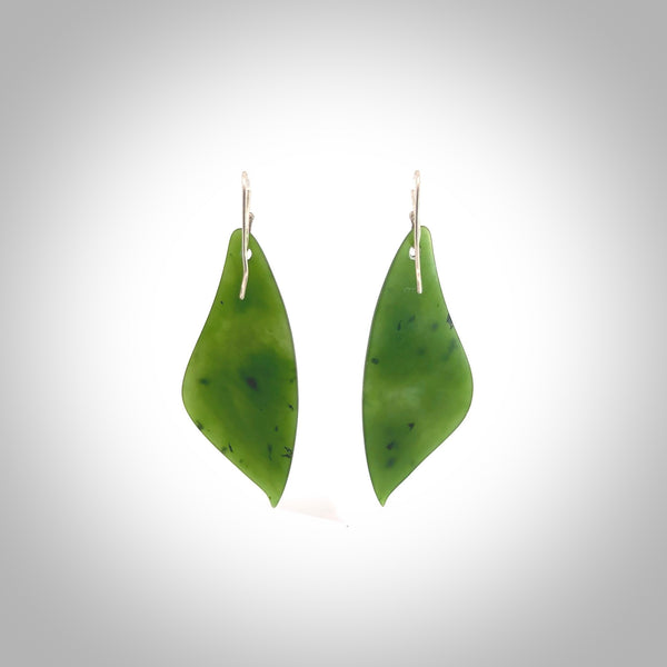 These are stunning large butterfly wing shaped drop jade earrings carved in New Zealand by Josey Coyle. It is carved from a deep, semi-translucent green piece of New Zealand Jade and with Sterling Silver hooks and findings.