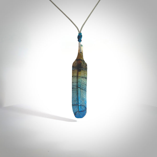 Hand carved blue Mammoth Tusk feather pendant with hand plaited adjustable cord. Woolly Mammoth tusk feather necklace. Hand carved by NZ Pacific. Art to Wear.
