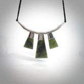 Hand crafted contemporary green jade and sterling silver drop necklace. This necklace is provided with a black adjustable cord. Contemporary three jade drops necklace with sterling silver.