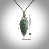 This is a very cool and creative fisherman hand made from New Zealand Jade and Sterling Silver. A fisherman who had caught a fish pendant hand crafted from sterling silver with Jade torso. A spectacular piece of art to wear.