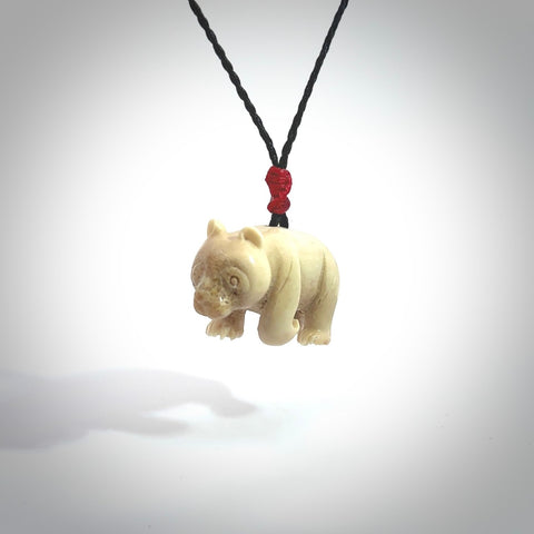 This picture shows a pendant that we designed in Woolly Mammoth Tusk. It is a little Panda bear that has a walking stance and is carved in detail. A really attractive and eye-catching piece of handmade jewellery. The cord is hand plaited braid in PALE HONEY and the length can be adjusted.