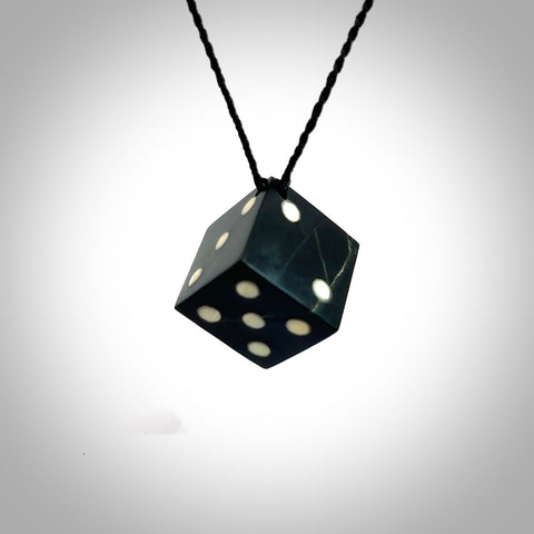 A hand carved large Black Jade square dice necklace. The cord is black and adjustable in length. A medium sized hand made dice necklace in Australian Black Jade. One off work of art to wear.