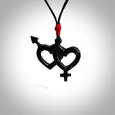 Hand carved double heart pendant made in your choice of black jade or jasper stone. Made by NZ Pacific. Carved from Red Jasper Stone and Black Jade. Black jade and red jasper stone heart with his and her symbols. Free delivery worldwide.