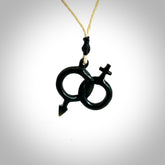 Hand carved double his and hers symbol pendant made in black jade and jasper stone. Made by NZ Pacific. Carved from black jade and red jasper stone. Free delivery worldwide.