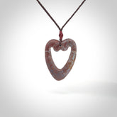Hand carved Red Jasper Stone contemporary heart pendant. Carved by NZ Pacific in Jasper Stone. This is a heart drop pendant made from natural materials.