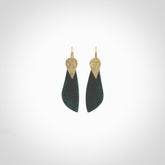 These are a pair of beautiful Goodletite Stone and gold leaf earrings. It is carved from Goodletite, ruby rock, Stone from New Zealand. It is a deep green colour with gold leaf. Hand made here in New Zealand by Ana Krakosky.