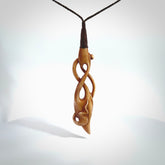 WILDERNESS is carved from cow bone and stained with a homemade tea dye. It is a unique piece of wearable art that is sure to catch the eye. The shape is a complex twist form and has been beautifully hand carved by bone carver Yuri Terenyi.