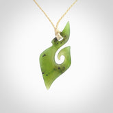 This photo shows a koru pendant carved from New Zealand Jade. The artist, Shaun Gardiner, has carved this beautifully. We provide this piece with an adjustable ice white coloured cord. This is a fantastic work of art, we have one only.