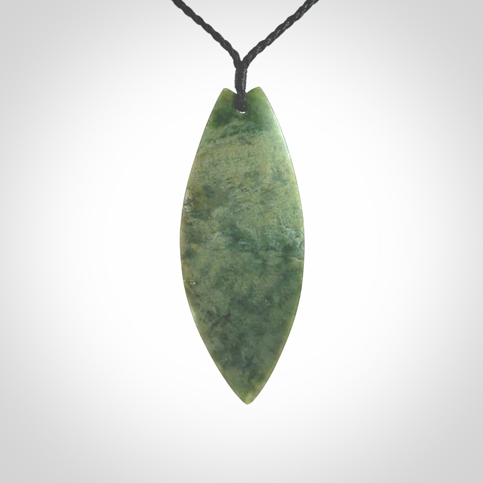 Hand carved New Zealand jade contemporary drop pendant. Hand carved in New Zealand by Darren Hill, jade artist, for NZ Pacific. One only, unique drop necklace with black adjustable cord. Free shipping worldwide.