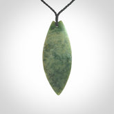 Hand carved New Zealand jade contemporary drop pendant. Hand carved in New Zealand by Darren Hill, jade artist, for NZ Pacific. One only, unique drop necklace with black adjustable cord. Free shipping worldwide.