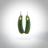 These are stunning art deco drop shaped jade earrings carved in New Zealand by Josey Coyle. They are carved from a light minty green piece of New Zealand Arahura Inanga Jade and with Sterling Silver hook and findings.