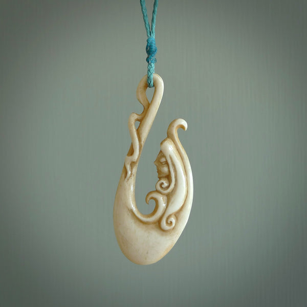 This pendant is a gorgeous and intricately carved mermaid hook pendant. Carved by renowned bone carver Yuri Terenyi for us. This is a masterpiece. It is a mermaid with her tail culminating into a hook. The craftsmanship displayed in this piece is extraordinary - a collectors item, or a piece to wear and love.