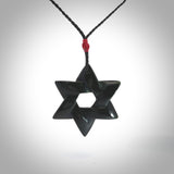 Hand carved New Zealand Tangiwai Pounamu Magen David necklace. Unique and creative art to wear from New Zealand Tangiwai Pounamu. Hand made New Zealand Tangiwai star of david pendant. Magen David pendant for men and women.