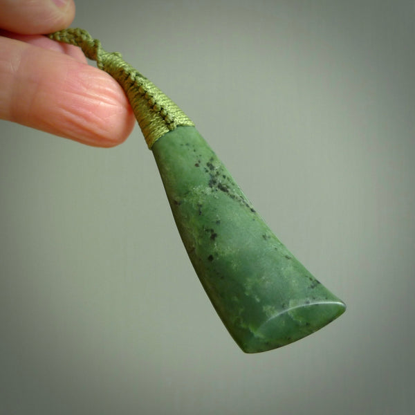 A lovely large sized New Zealand jade drop pendant. This piece is made from a light, mint green jade and is a wonderful light green colour. Carved by Ric Moor for NZ Pacific and delivered worldwide.