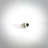 This is a handcrafted New Zealand Pounamu, Jade and sterling silver ring. This is a solid little work of art. We ship this worldwide for free and are happy to answer any questions that you may have about these or other products on our website. Hand made by Ana Krakosky. Contemporary art to wear, one only ring. Delivered with Express Courier and packaged in a woven kete pouch.