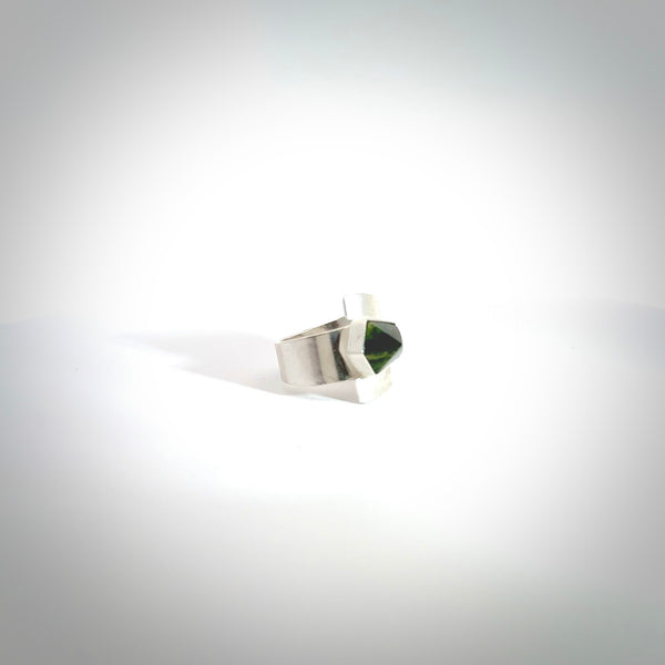 This is a handcrafted New Zealand Pounamu, Jade and sterling silver ring. This is a solid little work of art. We ship this worldwide for free and are happy to answer any questions that you may have about these or other products on our website. Hand made by Ana Krakosky. Contemporary art to wear, one only ring. Delivered with Express Courier and packaged in a woven kete pouch.