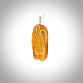 This pendant is handcrafted from rare Kauri Gum Amber. It is supplied with an sterling silver chain. It is a graceful and very interesting piece that will attract admiration and comment. Hand carved here in New Zealand.