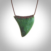 This pendant is a sized niho with koru heart necklace carved from a deep green piece of New Zealand Jade. Kyohei Noguchi carved this piece for us so the workmanship is outstanding. Handmade in New Zealand, a beautiful piece of jade jewellery.