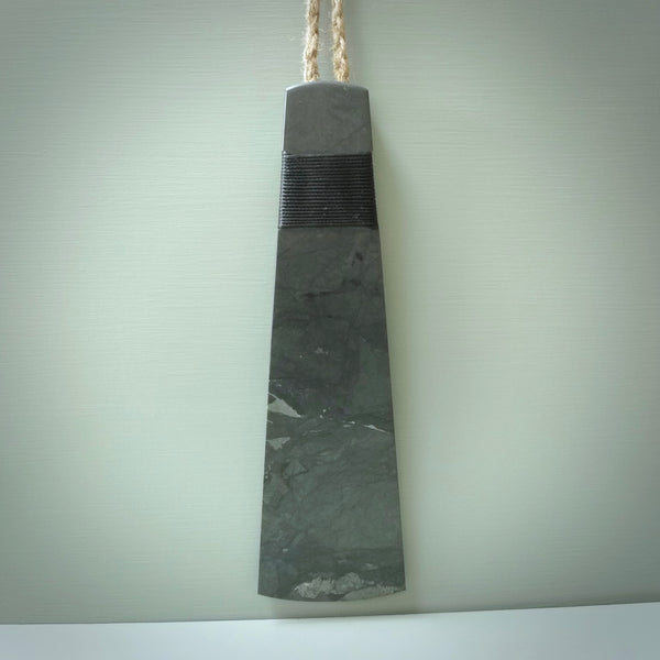 Hand carved large New Zealand Argillite Stone Wall hanging toki. Hand made wall hanging toki displayed in New Zealand Pākohe stone. Hand carved here in New Zealand by Kerry Thompson. This is a 'one only' sculpture, a beautiful display piece.