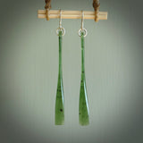 This picture shows hand carved New Zealand Jade, Pounamu paddle shaped, drop earrings. Delivery is free worldwide. NZ made Jade earrings. One pair only hand carved by New Zealand artist, Nicola Rees.