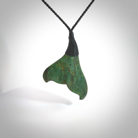 Hand carved New Zealand Jade whale tail pendant. Carved for NZ Pacific. Handmade ocean themed jewellery for sale online. Hand made by Kyohei Noguchi.