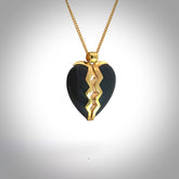 This is a handcarved love heart pendant made from a gorgeous and striking piece of Black Jade with gold plated silver. This is a superbly carved and very unique piece if custom jewellery. For sale online from NZ Pacific.