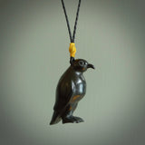 This pendant is a hand carved YELLOW EYED penguin. We've carved this from a lovely piece of black jade and we provide it with a hand plaited cord. Shipping is free worldwide.