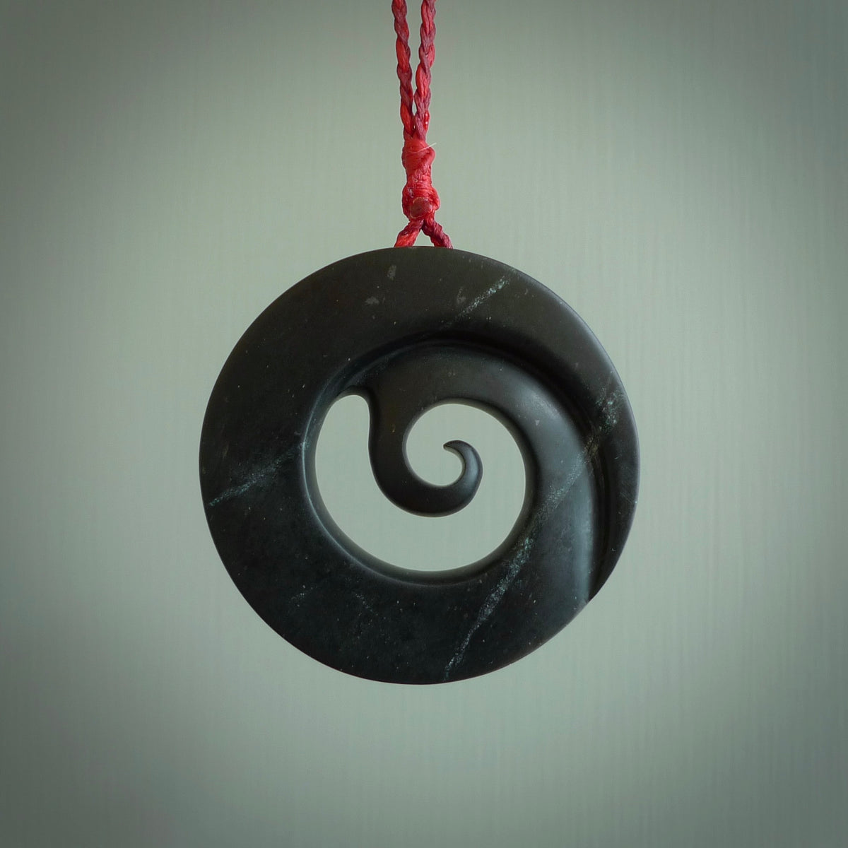 HAND CARVED NEW ZEALAND JADE KORU PENDANT. POUNAMU KORU NECKLACE