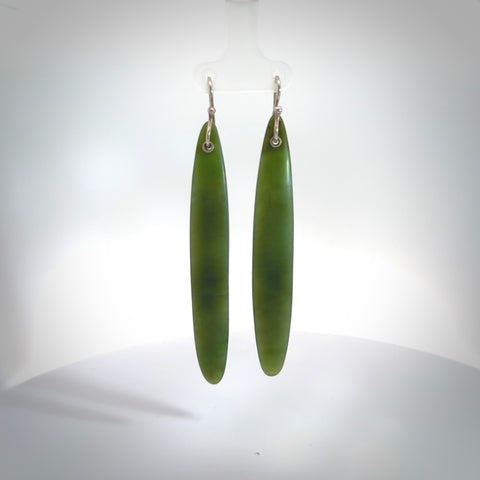These are stunning large drop shaped jade earrings carved in New Zealand by Josey Coyle. It is carved from a apple green piece of New Zealand Jade and with Sterling Silver hooks.