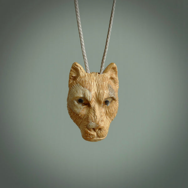These are small puma cub pendants. They are hand carved from Mammoth tusk and are beautiful. We provide it with a hand plaited cord. Shipping is free worldwide.