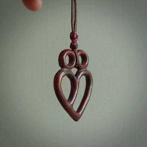 This is a handcarved love heart pendant made from a gorgeous and striking piece of red jasper stone. This is a superbly carved and very unique piece if custom jewellery. For sale online from NZ Pacific.